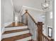 Staircase with wooden stairs, railing and hardwood floors at 859 Heritage Lake Way, Grayson, GA 30017