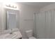 Cozy bathroom with shower-tub combination, bright lighting, and a neutral color palette at 11354 Conner Ct, Hampton, GA 30228