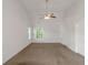 Bedroom boasts vaulted ceiling, ceiling fan, and bright natural light at 11354 Conner Ct, Hampton, GA 30228