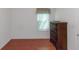 Bedroom featuring tile floors, a window for natural light and a dark wood dresser at 11354 Conner Ct, Hampton, GA 30228
