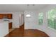 Cozy dining area featuring hardwood floors, white trim, and natural light at 11354 Conner Ct, Hampton, GA 30228