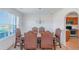 Formal dining room with wainscoting, an elegant chandelier, and seating for six at 11354 Conner Ct, Hampton, GA 30228