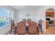 Elegant dining room featuring a large window, decorative chandelier, and seating for six at 11354 Conner Ct, Hampton, GA 30228