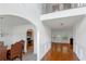 Bright foyer with hardwood floors leads to the dining room and spacious living area with fireplace at 11354 Conner Ct, Hampton, GA 30228