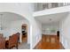 Bright foyer with hardwood floors, arched entryway, and view to the living room at 11354 Conner Ct, Hampton, GA 30228