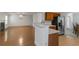 Open concept view to the kitchen with bar and stainless refrigerator at 11354 Conner Ct, Hampton, GA 30228