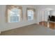 Cozy living room with a large window and view to the dining room at 11354 Conner Ct, Hampton, GA 30228