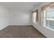 Comfortable living room with natural light through windows and neutral-toned walls at 11354 Conner Ct, Hampton, GA 30228