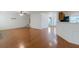 Spacious living room featuring hardwood floors, white walls, and staircase at 11354 Conner Ct, Hampton, GA 30228