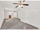 Large bedroom with neutral carpet, two ceiling fans, and natural light at 1508 Franklin Cir, Dacula, GA 30019