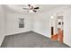 This bedroom features neutral carpet, one window, and a closet with modern doors at 1508 Franklin Cir, Dacula, GA 30019