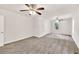 Bedroom with neutral carpet, ceiling fan, window, and a closet at 1508 Franklin Cir, Dacula, GA 30019