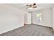 Bright bedroom with neutral carpet, a window, and a closet ready for personalization at 1508 Franklin Cir, Dacula, GA 30019