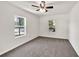 Cozy bedroom features neutral carpet, two windows, and ample natural light at 1508 Franklin Cir, Dacula, GA 30019