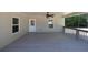 Large, covered back deck featuring a ceiling fan and ample space for outdoor seating at 1508 Franklin Cir, Dacula, GA 30019