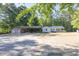 Charming single-story home with large carport, garage, and ample parking space at 1508 Franklin Cir, Dacula, GA 30019