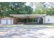 Exterior of home featuring a large carport and garage at 1508 Franklin Cir, Dacula, GA 30019