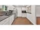An open view of a bright kitchen with stainless steel appliances and granite countertops at 1508 Franklin Cir, Dacula, GA 30019