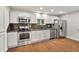 Updated kitchen featuring stainless steel appliances, granite countertops, and bright white cabinetry at 1508 Franklin Cir, Dacula, GA 30019