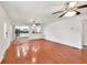 Light-filled living room with hardwood floors and an open layout into the kitchen at 1508 Franklin Cir, Dacula, GA 30019