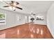Bright and spacious living room boasting hardwood floors, ceiling fans, and natural light at 1508 Franklin Cir, Dacula, GA 30019