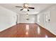 Spacious living room with hardwood floors, ceiling fan, and a bright, airy feel at 1508 Franklin Cir, Dacula, GA 30019