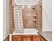 Shower with tiled walls and shower curtain at 1508 Franklin Cir, Dacula, GA 30019