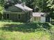 View of home with lush yard showcasing the property's idyllic setting at 181 Eureka Ne Dr, Atlanta, GA 30305