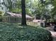 Quaint home with unique architectural design nestled amongst mature trees and lush greenery at 181 Eureka Ne Dr, Atlanta, GA 30305
