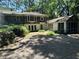 Charming home featuring a stone-accented driveway, screened-in porch, and unique architectural details at 181 Eureka Ne Dr, Atlanta, GA 30305