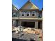 New construction townhome featuring a brick facade and an attached two-car garage at 3106 Marbella Cir # 3, Kennesaw, GA 30152