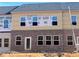 New construction townhome featuring a brick facade and lots of windows at 3106 Marbella Cir # 3, Kennesaw, GA 30152