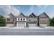 New construction townhomes with brick and siding exteriors and attached garages at 3106 Marbella Cir # 3, Kennesaw, GA 30152