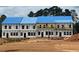 New construction townhomes featuring construction workers and blue protective roof wrap at 3106 Marbella Cir # 3, Kennesaw, GA 30152