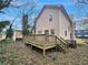 Backyard with wooden deck area. The yard is surrounded by mature trees and foliage at 392 Vine St, Atlanta, GA 30314