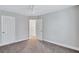 Bedroom featuring carpet, multiple closets, and access to the upstairs at 392 Vine St, Atlanta, GA 30314