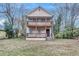 Two-story tan home with double front porches and a small, grassy front yard at 392 Vine St, Atlanta, GA 30314