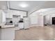 Bright kitchen with white appliances and cabinetry next to a large opening at 392 Vine St, Atlanta, GA 30314