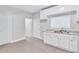 Bright kitchen with white cabinets and tile floors, ample counter space at 392 Vine St, Atlanta, GA 30314