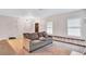 Living room with gray sofa, neutral carpet, and ample natural light at 392 Vine St, Atlanta, GA 30314
