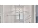 Bright stairwell with white banister under a modern pendant light fixture at 392 Vine St, Atlanta, GA 30314