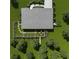 Aerial view of a home with a meticulously landscaped backyard and patio set at 5034 Hickory Hills Dr, Woodstock, GA 30188