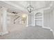 Spacious basement featuring elegant columns, recessed lighting, and versatile living space at 5034 Hickory Hills Dr, Woodstock, GA 30188