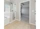 Spacious main bathroom with glass enclosed shower, soaking tub, and an open entrance to the main bedroom at 5034 Hickory Hills Dr, Woodstock, GA 30188