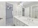Modern bathroom with double sink vanity, a large mirror, and neutral paint at 5034 Hickory Hills Dr, Woodstock, GA 30188