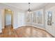 Bright dining area with hardwood flooring and access to the backyard deck at 5034 Hickory Hills Dr, Woodstock, GA 30188
