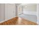 Inviting foyer showcasing hardwood floors, and leading to a formal dining area with abundant natural light at 5034 Hickory Hills Dr, Woodstock, GA 30188