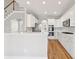 Stylish kitchen featuring white cabinets, stainless steel appliances, and a breakfast bar at 5034 Hickory Hills Dr, Woodstock, GA 30188