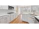 Modern kitchen showcases white cabinets, quartz counters, and stainless steel appliances at 5034 Hickory Hills Dr, Woodstock, GA 30188