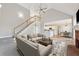 Bright living room showcasing soaring ceilings, a cozy fireplace, and an open floor plan to the kitchen at 5034 Hickory Hills Dr, Woodstock, GA 30188